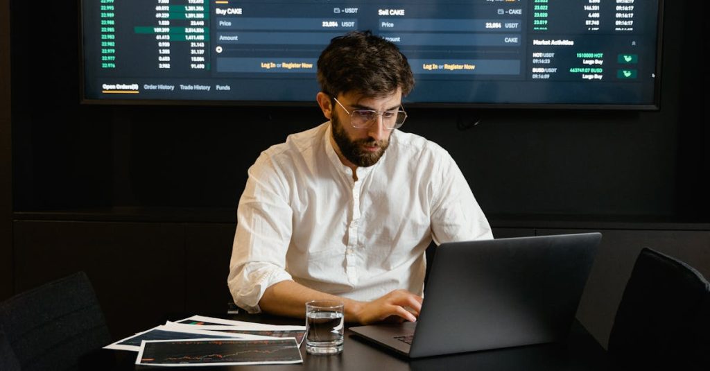 Focused Professional Man using Laptop